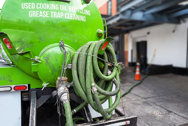 large truck pumping grease trap at a restaurant in Dauphin, PA